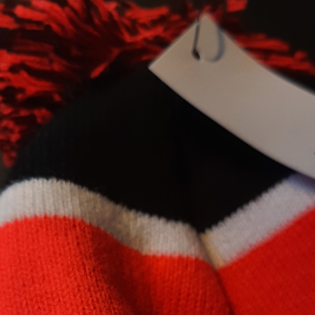 60684621_mclaren_racing_sports_beanie_luva_mössa_f1_formel1_formula1_f1sweden_f1sverige_official_merch_new_era_westcoast_motorsport_closeup_dark